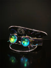 Black captain hat with iridescent leopard print pattern and iridescent goggles.