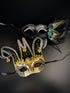 Couples masquerade mask set in gold and black, with a jester mask for the men and a peacock mask for the women.