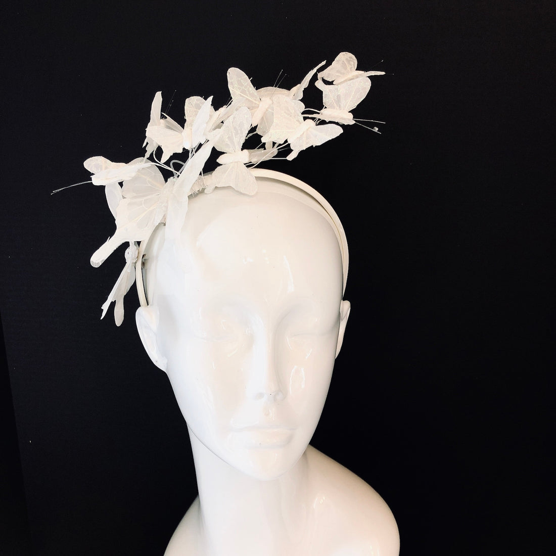 White butterfly fascinator headpiece.