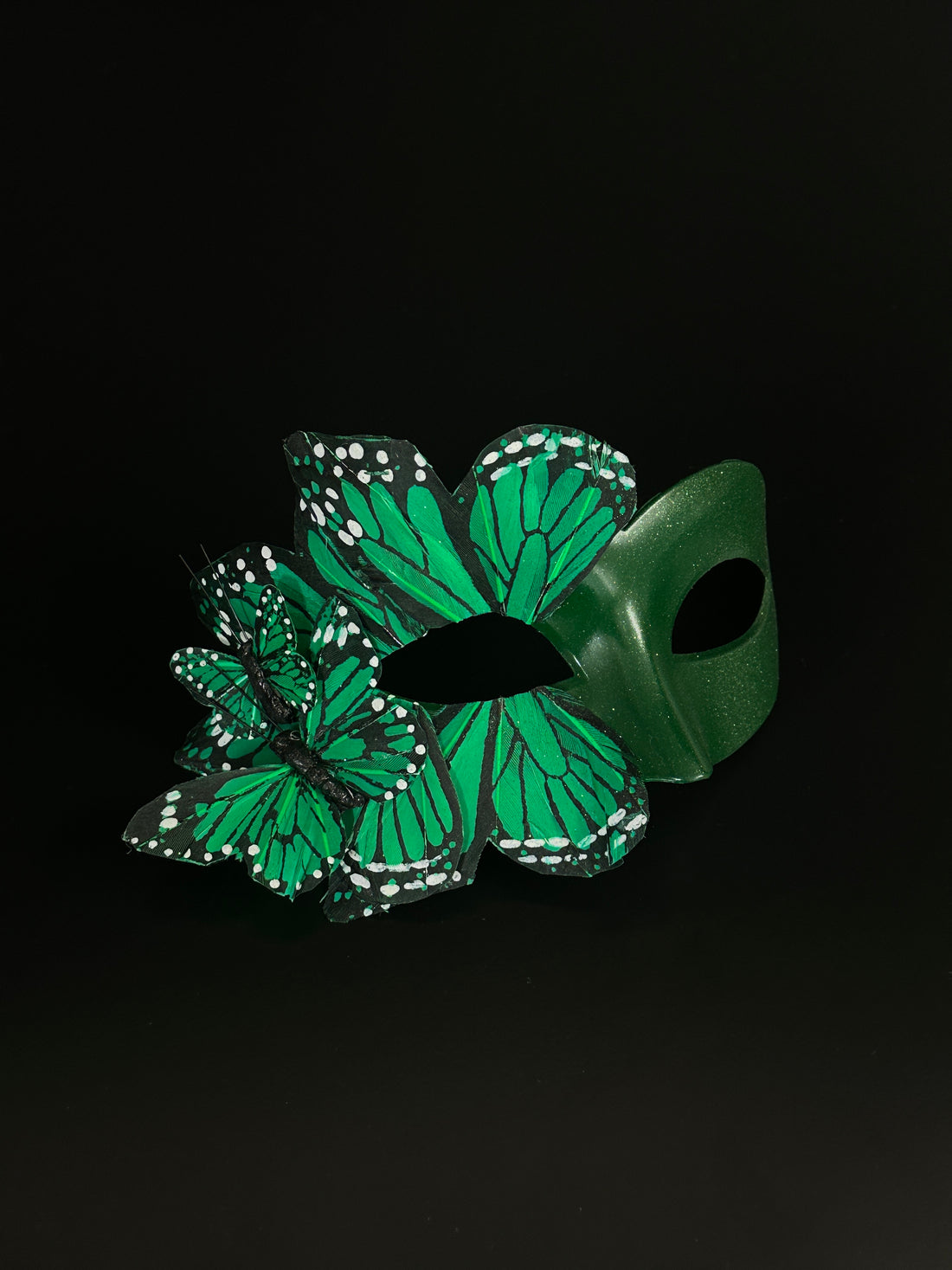 emerald green masquerade mask in butterfly design