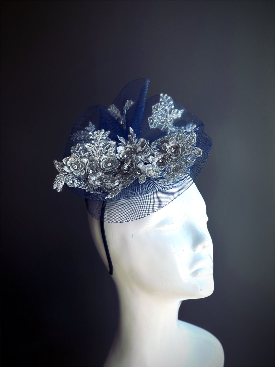 Navy blue tulle fascinator base with silver floral lace.