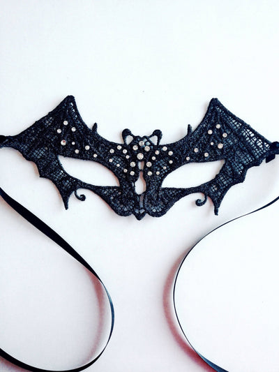 Kid's masquerade mask in a black bat shape with rhinestones for sale.