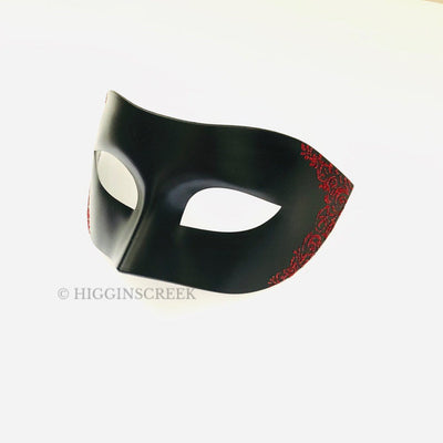 Men's masquerade mask in black with red glitter filigree sides for sale.