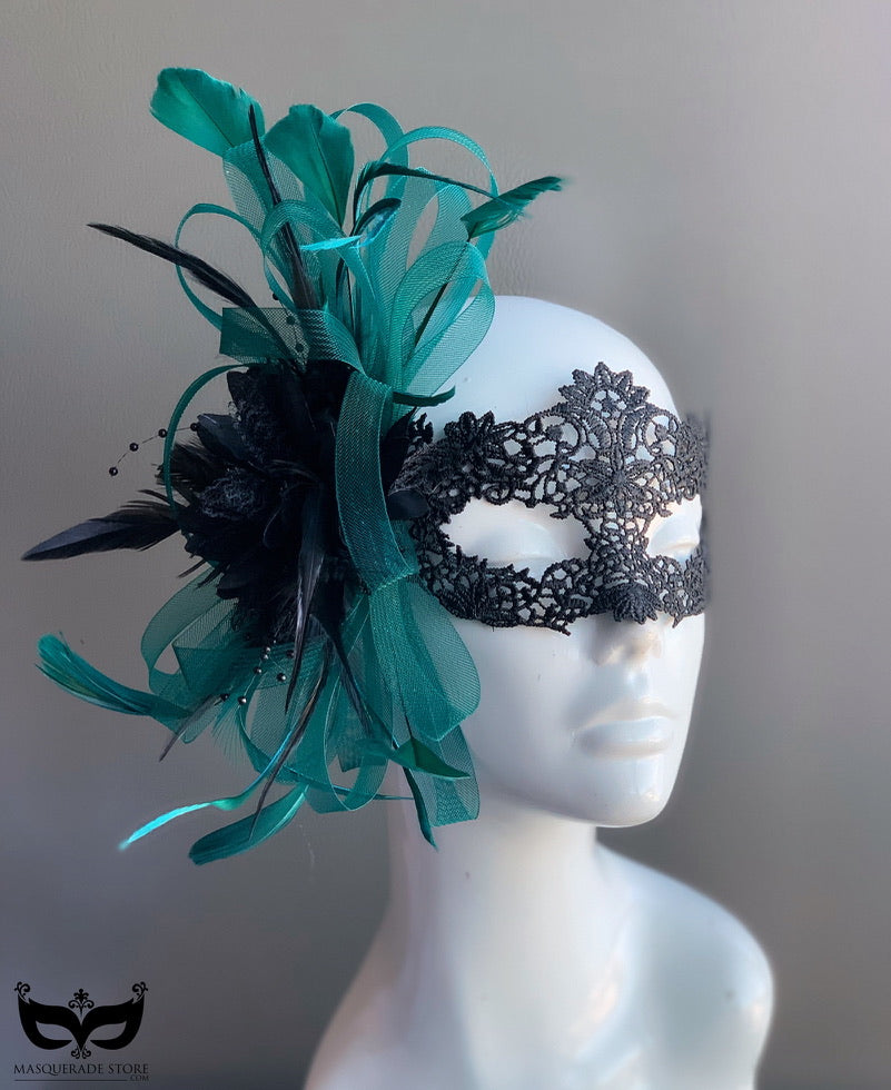 Black lace masquerade mask with teal feathers and tulle accents