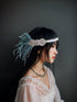 Blue flapper headband with silver crystal accents and feathers, ideal for Gatsby-themed parties and elegant events.