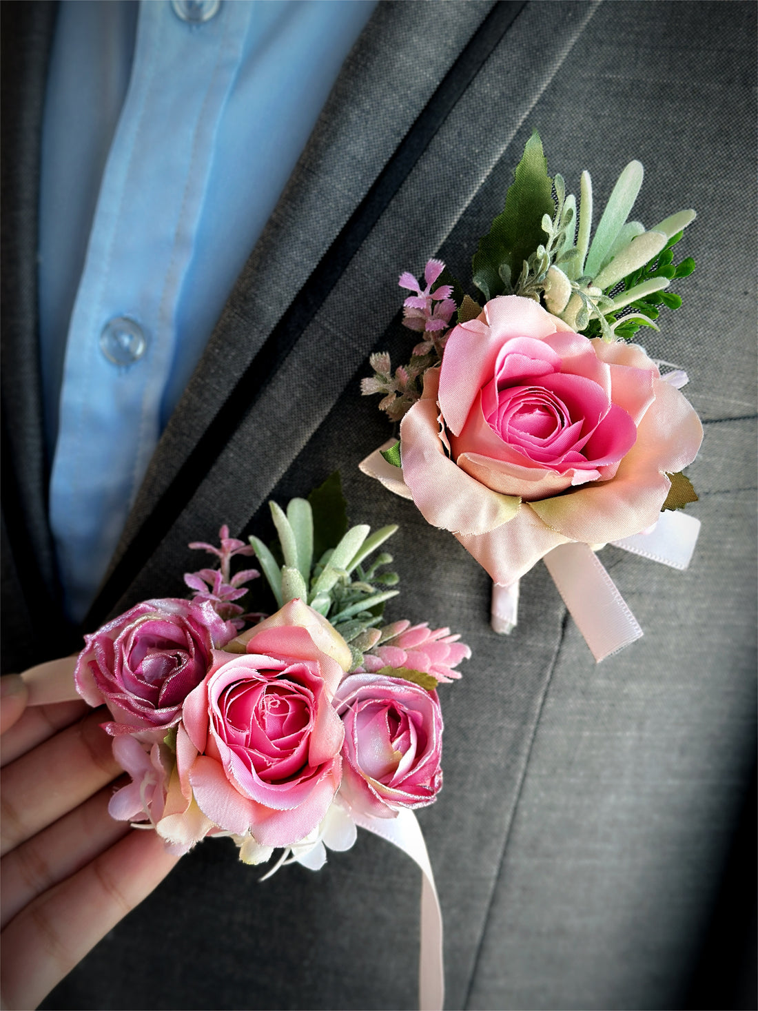 Pink rose prom boutonniere and corsage set with silk roses and greenery.