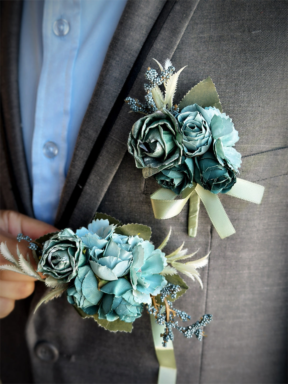 Elegant prom boutonniere and corsage set with lush florals and ribbon accents.