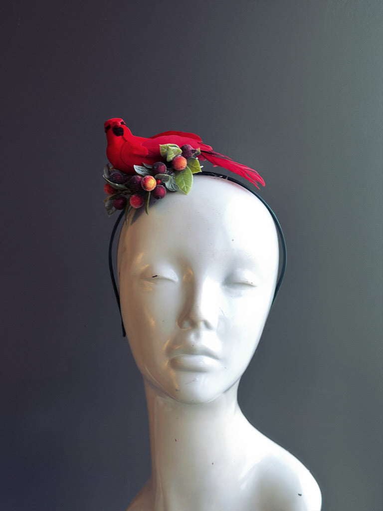 Holiday headband featuring a red cardinal, festive berries, and green foliage, perfect for Christmas and seasonal celebrations.