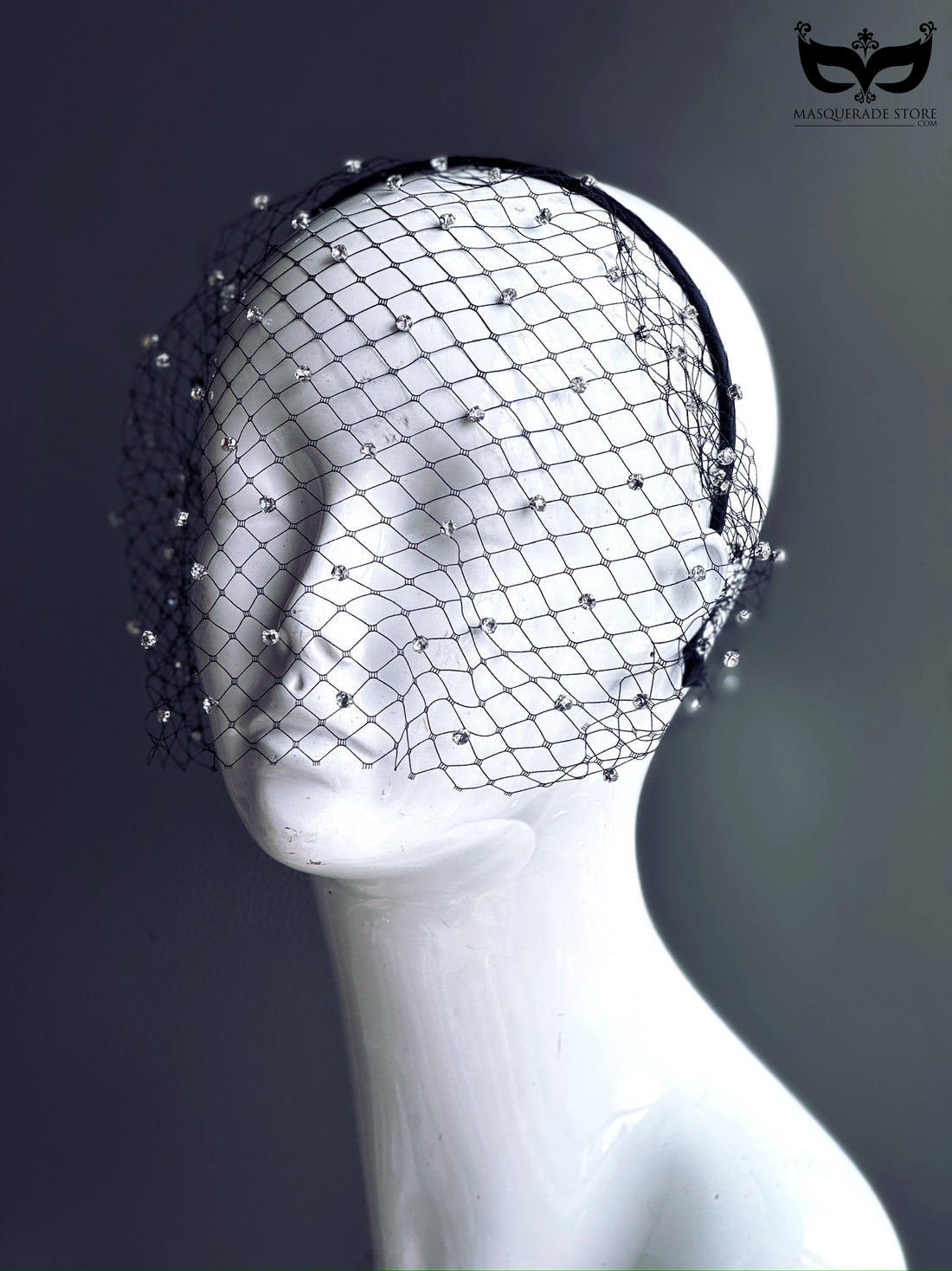 A black net veil headband adorned with sparkling crystal accents, ideal for weddings, evening events, and stylish occasions.