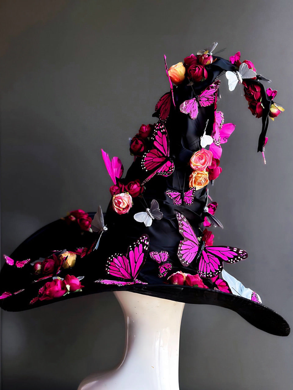 Custom witch hat decorated with pink butterflies and roses, perfect for Halloween and fantasy events.