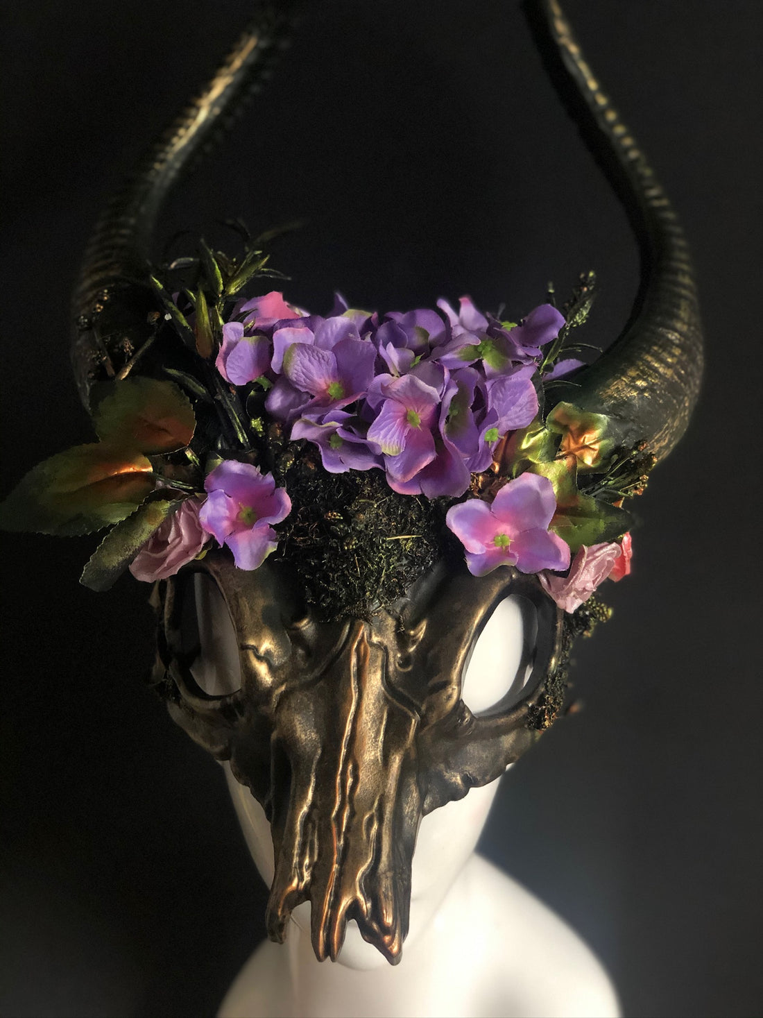 Gaelic enchanted ram horn headdress with bronze textures, violet florals, and moss details.