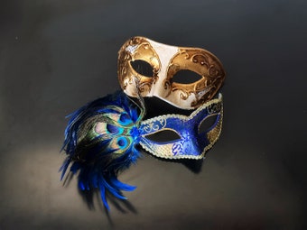  Gold and blue Venetian-style couple masks, one with ornate gold details and the other with a vibrant peacock feather accent, ideal for elegant occasions.