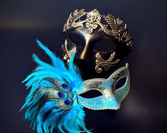 Gold Venetian-style mask paired with a turquoise mask featuring ornate details and vibrant peacock feather accents, ideal for formal occasions.