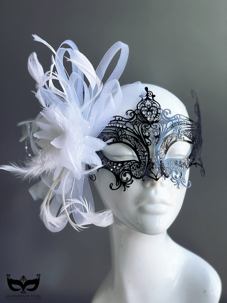 Gossip Mask with black filigree, feathers, tulle, and decorative brooch