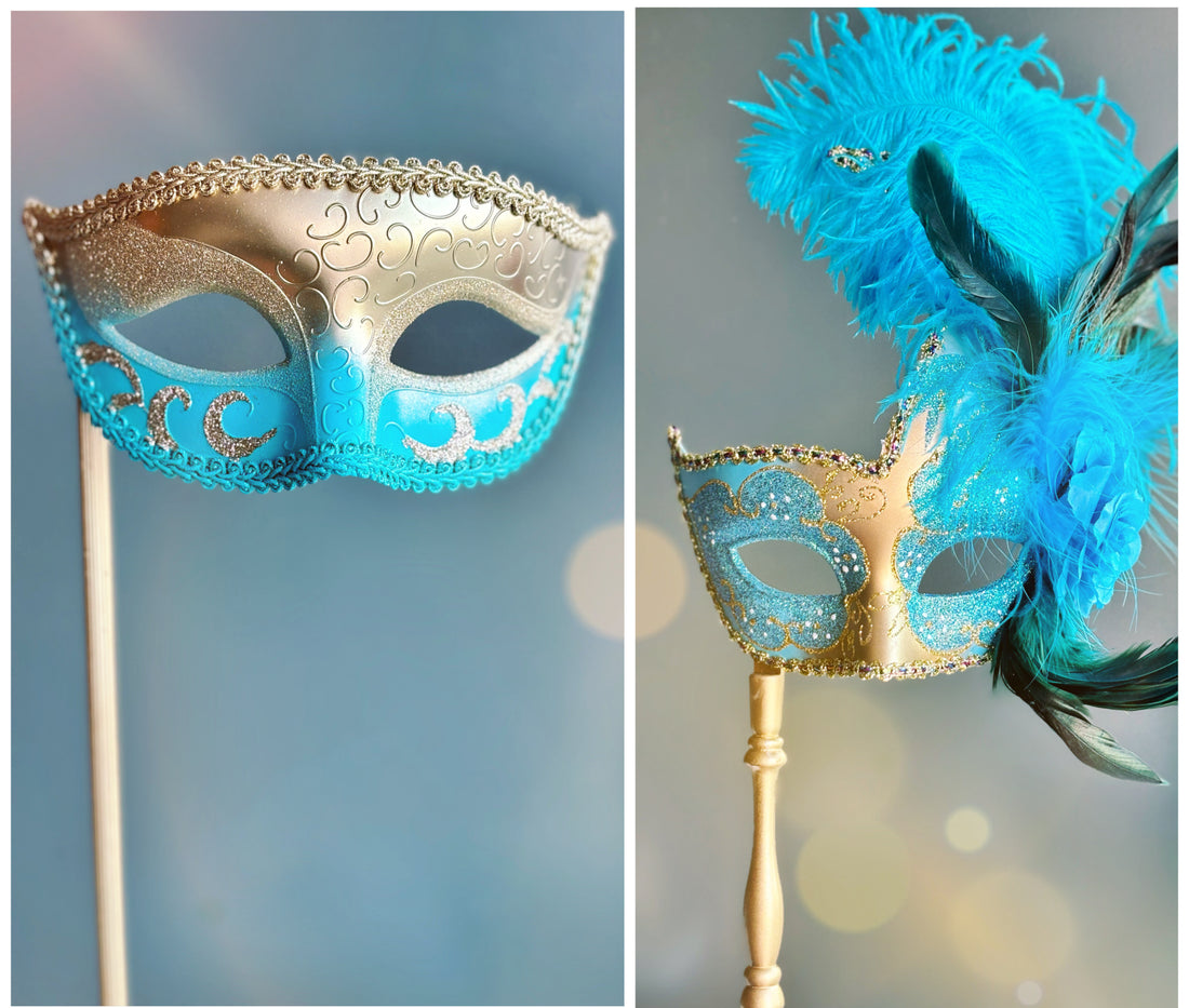 Set of handheld turquoise and gold Venetian masks, one with elegant scrollwork and the other with vibrant feathers and glitter accents.