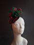 Christmas fascinator with green tulle, red embroidery, and pearl details, perfect for festive celebrations and holiday parties.