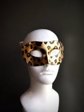 Venetian mask with a leopard print design, ideal for themed parties, costume events, or masquerade celebrations.