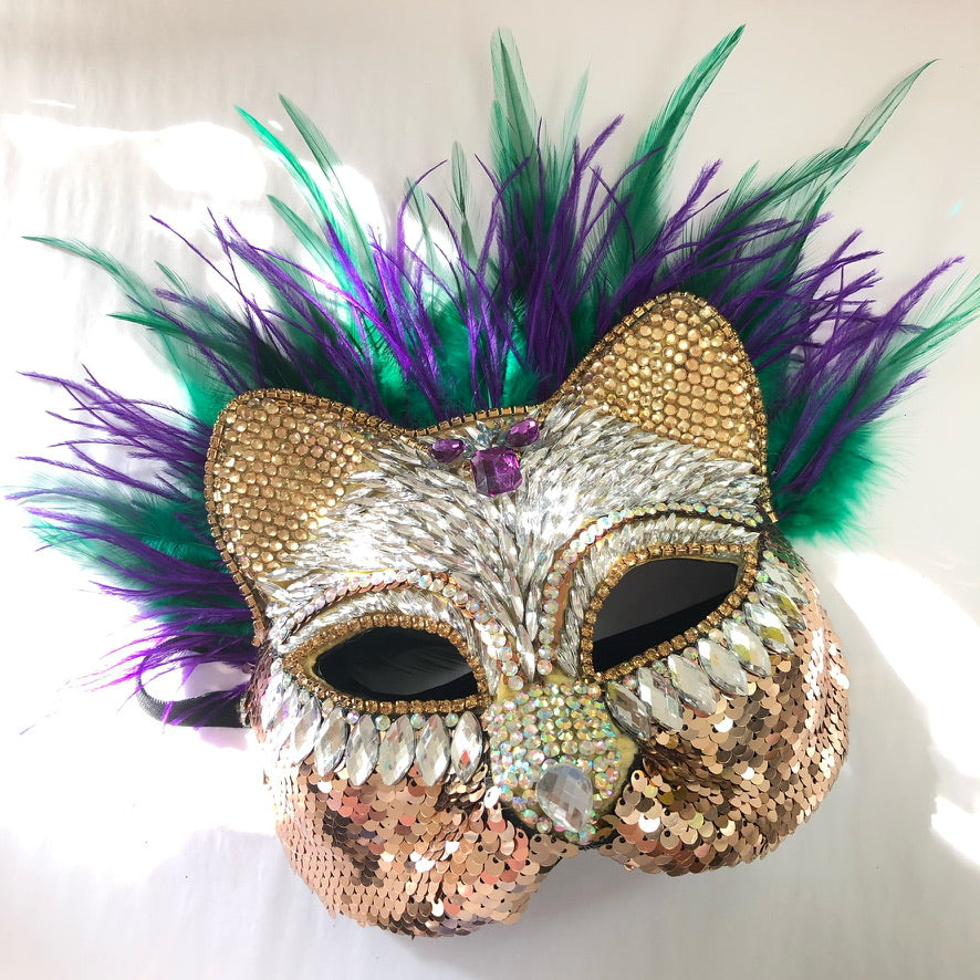 Mardi Gras Therian Cat Mask with gold sequins, vibrant purple and green feathers, and rhinestone details, perfect for festive celebrations.