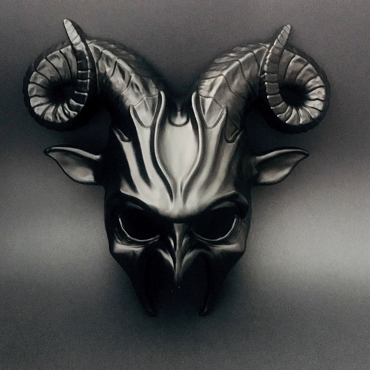 Baphomet masquerade mask with black and gold horned details