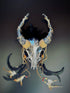 ram horn skull headdress featuring intricate hand-finished details, twine-wrapped horns, and ritualistic feather adornment