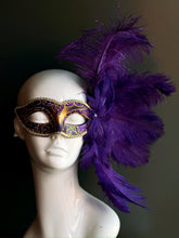 Regal Purple Feather Mask with golden accents and dramatic feather arrangement.