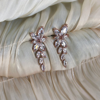 Rose gold floral-inspired earrings with cubic zirconia, designed for timeless elegance and a radiant sparkle.