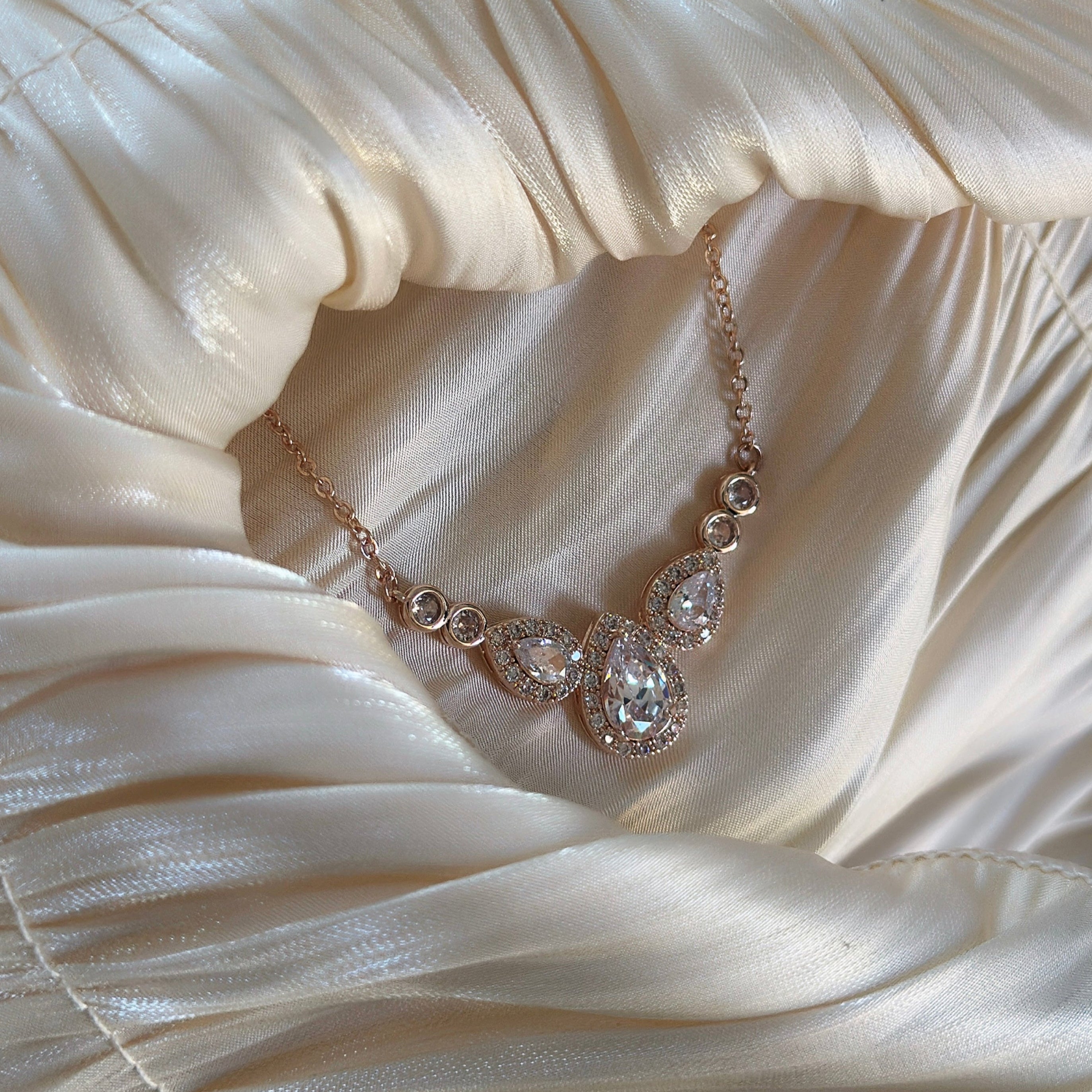 Rose Gold Celestial Droplet Necklace with a pear-shaped cubic zirconia pendant on a delicate chain