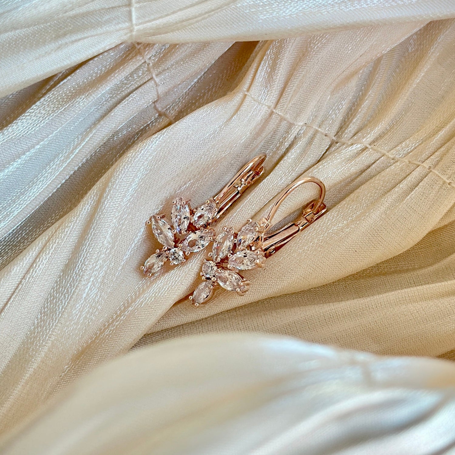 Rose gold earrings with floral-inspired crystal accents, hypoallergenic, non-tarnish, and waterproof—ideal for formal occasions and everyday elegance.