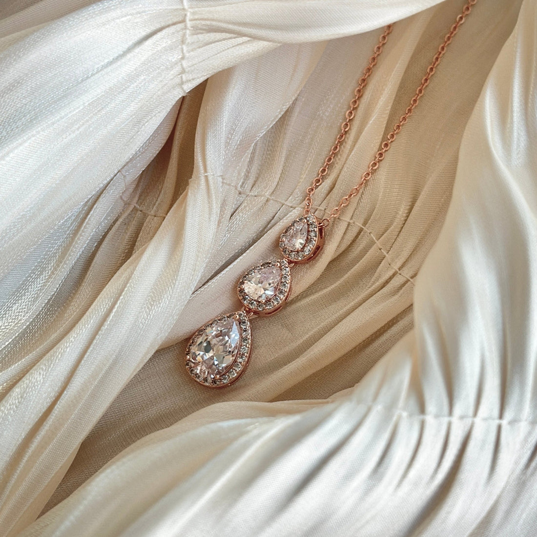 Rose gold necklace with three teardrop-cut crystals, hypoallergenic, non-tarnish, and waterproof—perfect for formal occasions or everyday glamour.