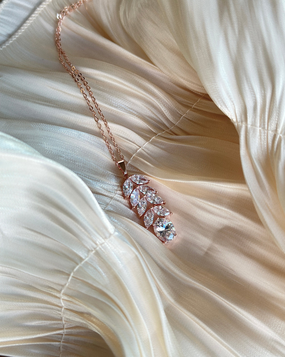 Rose gold necklace with a delicate vine of marquise-cut crystals, hypoallergenic, non-tarnish, and waterproof—ideal for elegant events or daily sophistication.