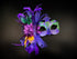 Elegant couples Mardi Gras mask set with purple, gold, and green designs, adorned glitter, feathers, and tulle.