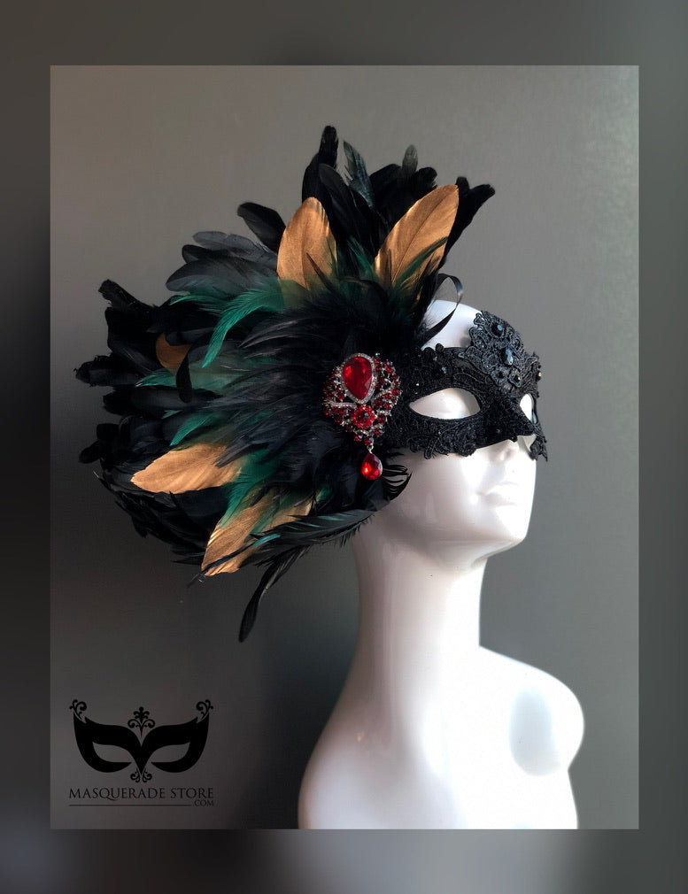 Scarlet Midnight Feather Mask featuring black, gold, and green feathers with a red gemstone centerpiece.