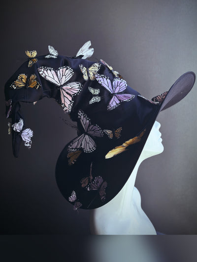 Signature witch hat with pastel butterflies in shades of lavender, pink, and cream for fantasy and Halloween events.