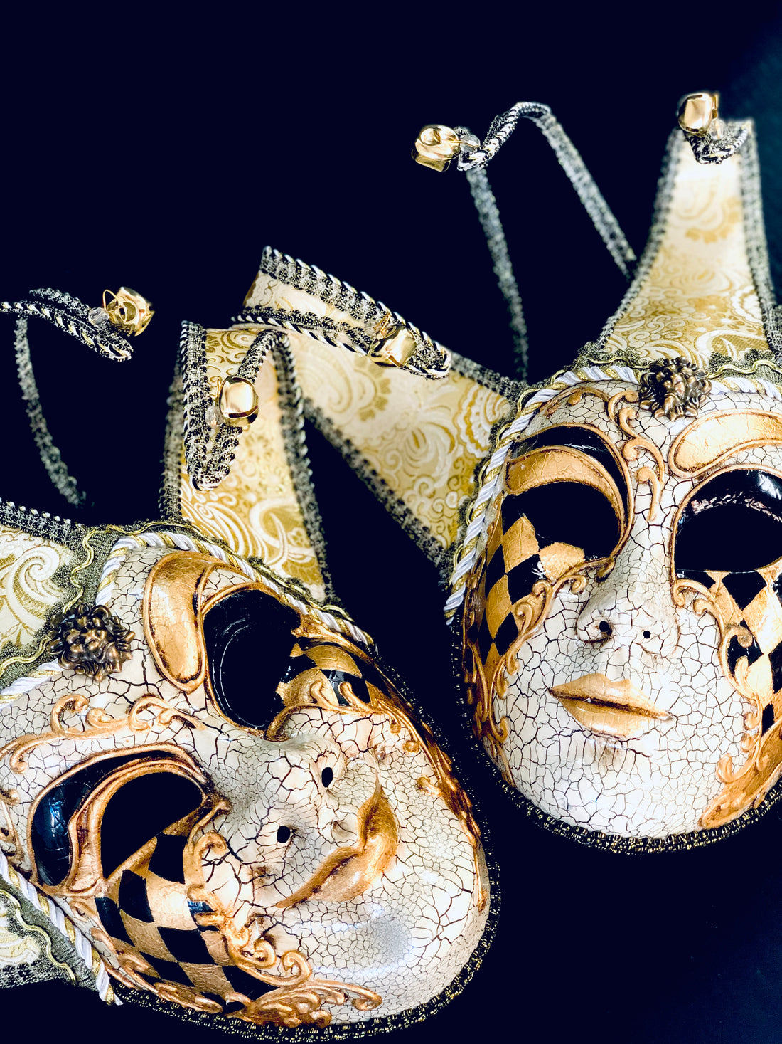 Venetian jester mask pair in gold and ivory with crackle texture, gold filigree, and jester points with bells