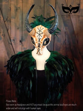 Ram horn headdress with runic symbols and a green feather cape, available separately or as a set.