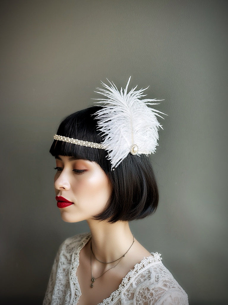 White feather flapper headband with rhinestone and pearl accents, perfect for Gatsby-themed events and weddings.

